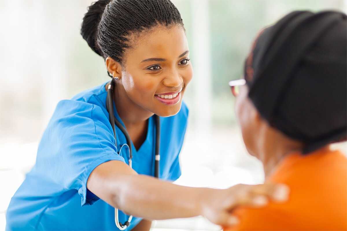 medical nurse comforting senior patient